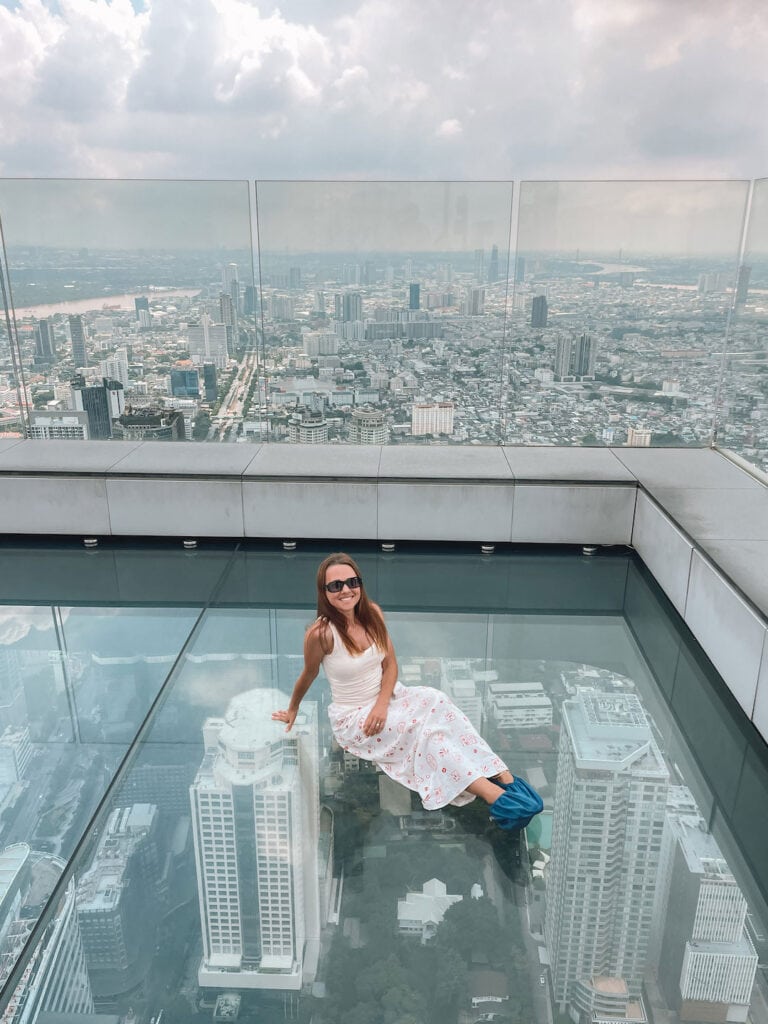 Sitting on the glass floor at King-Power-Mahanakhon. Attraction in Bangkok