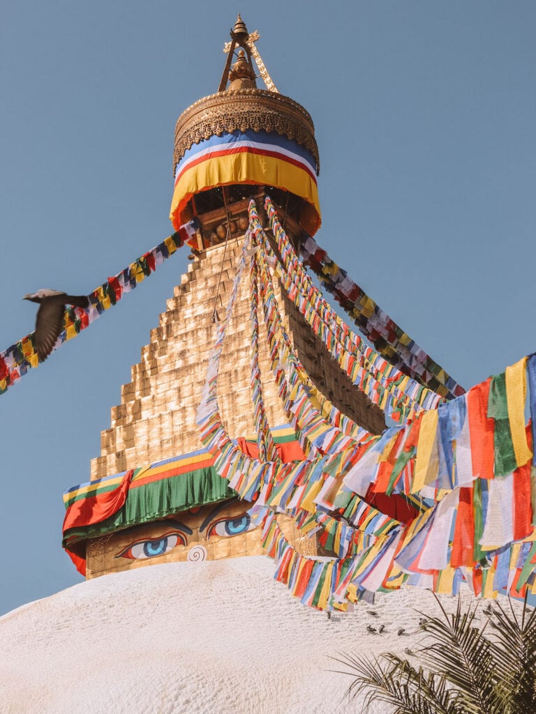 close up of Boudhanath Stupa and colorful pray flags
