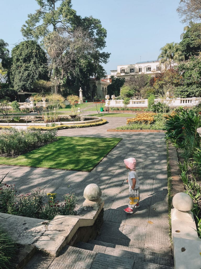 Toddler enjoying the outdoor space in garden of dreams