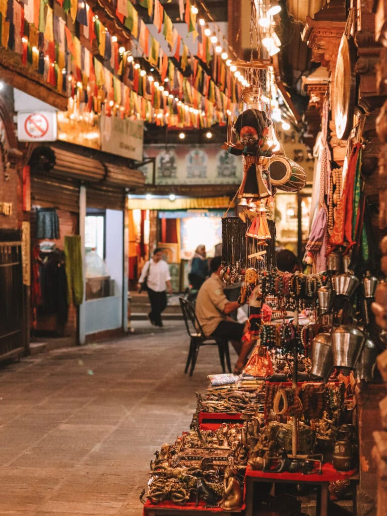 night view in Thamel Kathmandu. Local store selling bracelets and other souvenirs and prayer flags above