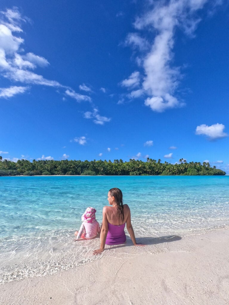 relaxing on one foot island with clear blue water and sky.